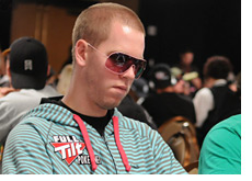 -- Jeff Madsen wearing white shades and a green striped shirt --