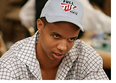 -- phil ivey with a winning smirk on his face - full tilt poker --