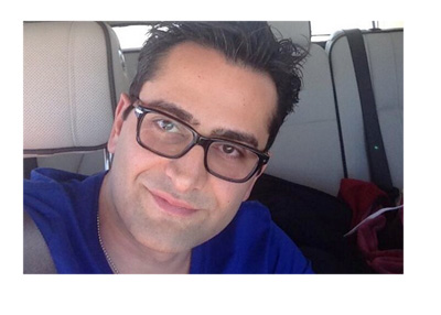 Antonio Esfandiari in the passenger seat of a car.  Twitter photo