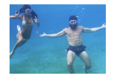 Dan Blizerian. Fish under water. Next to a gorgeous babe, of course.