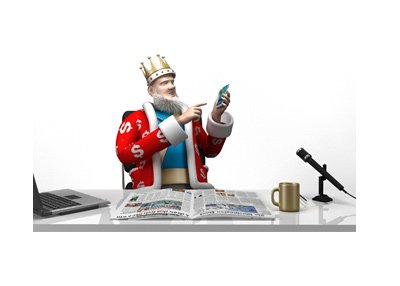 The King is at the office desk pointing towards his mobile phone.