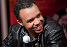 Phil Ivey at the table smiling - Wearing a black leather jacket - Photo updated on Sept 27th 2010 - at the WSOPE