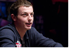Tom Dwan at the table - looking very happy